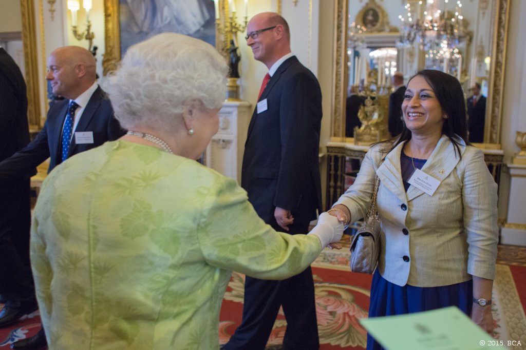 Lopa Patel is presented to Her Majesty The Queen during The Queen's Award for Enterprise 2015 reception. Image copyright of British Ceremonial Arts (BCA)